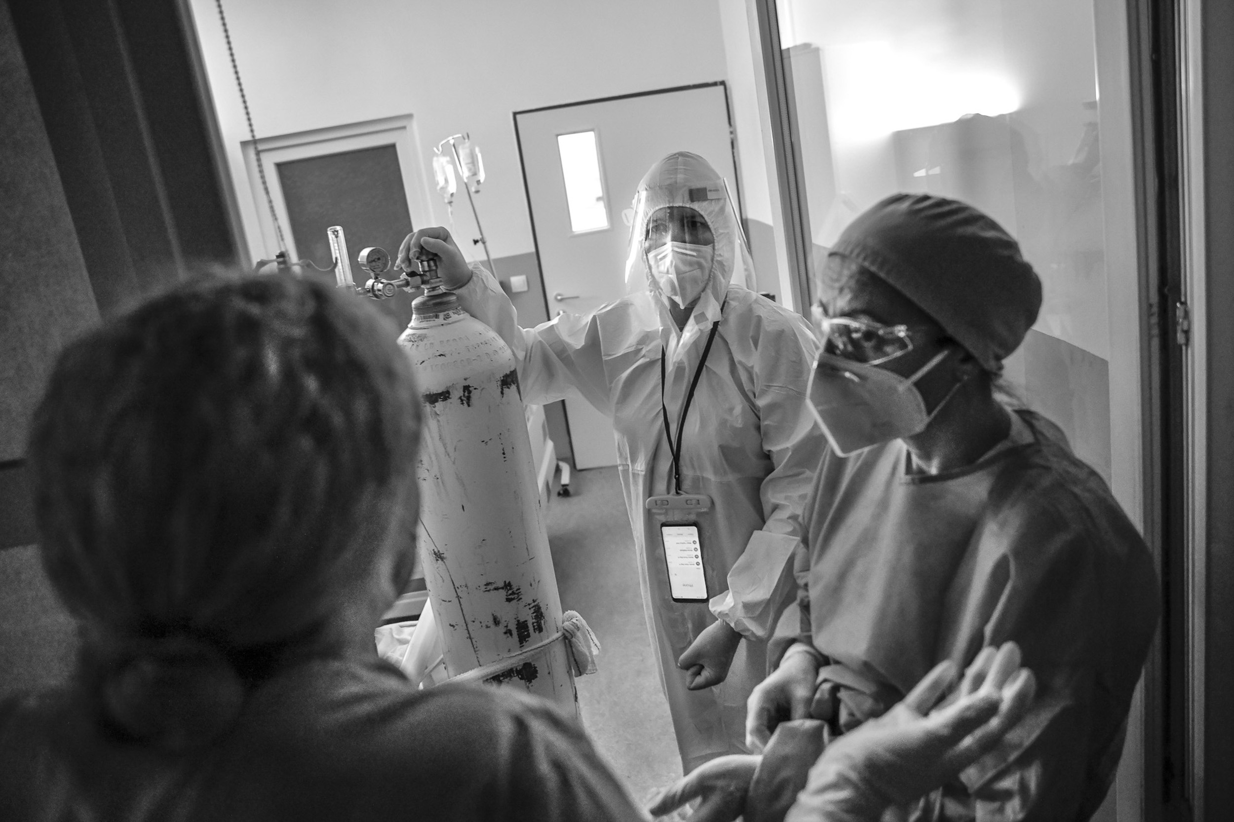 Dr. Linidita (center) discusses care options with other medical staff.