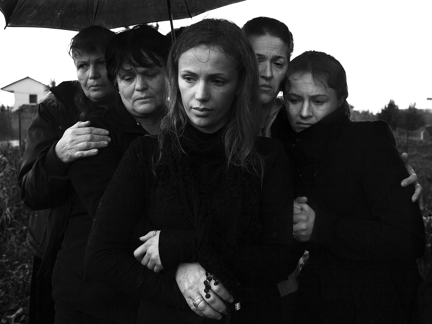 During a funeral. According to Albanian tradition, men and women are attending a funeral in seperate groups.
Tirana, Albania, 2012